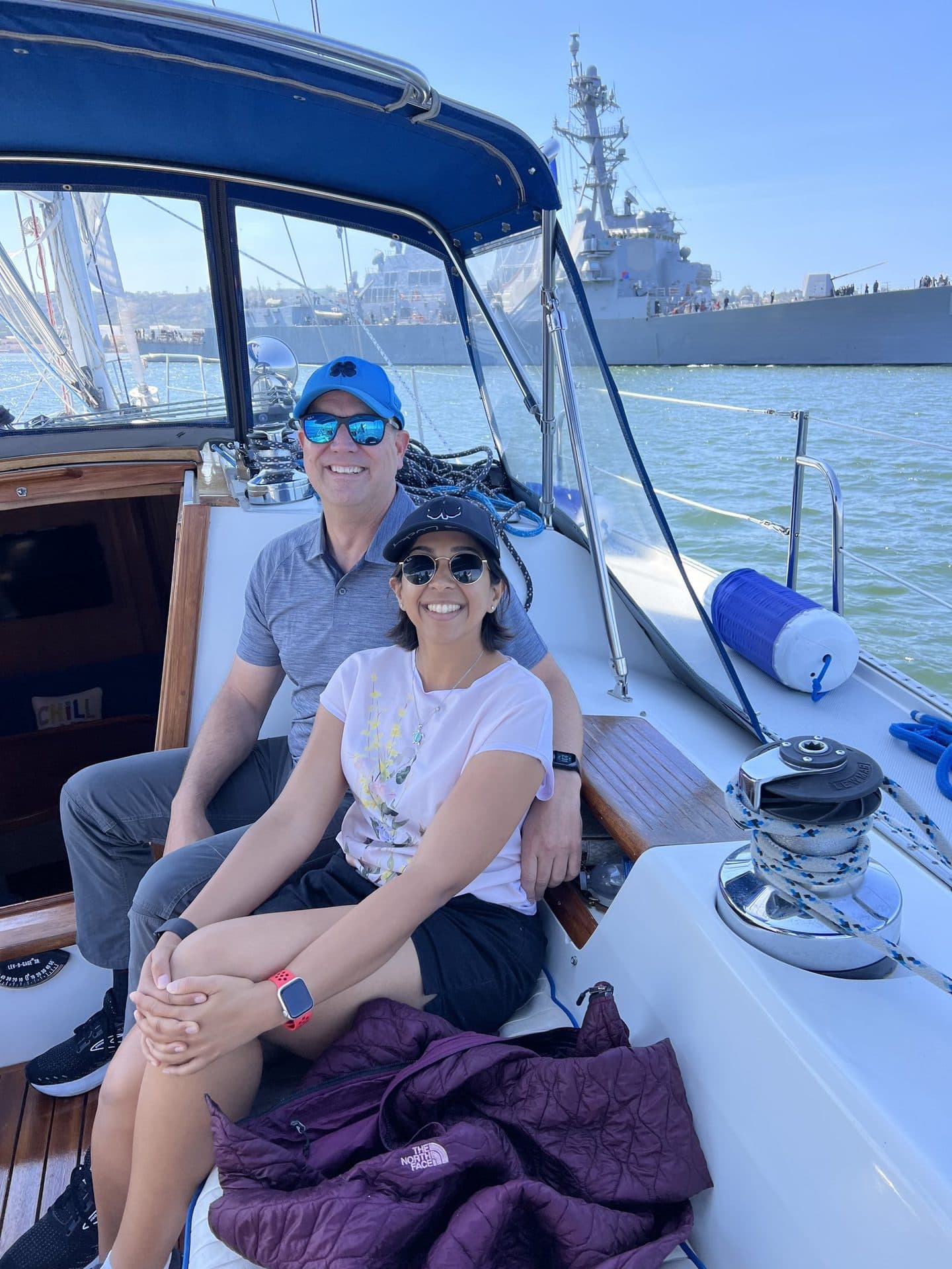 Guests sailing past a U.S. Navy warship on a San Diego harbor tour aboard the Mojave