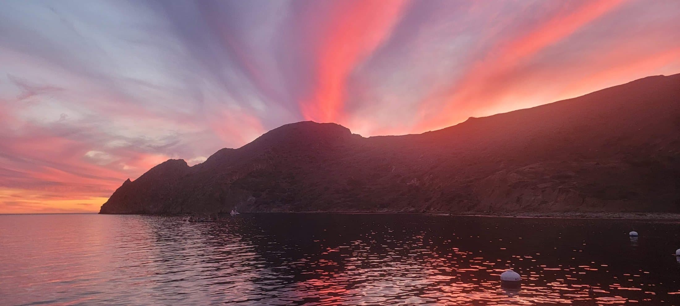 Dramatic sunset over Point Loma from a private sailing charter on San Diego Bay